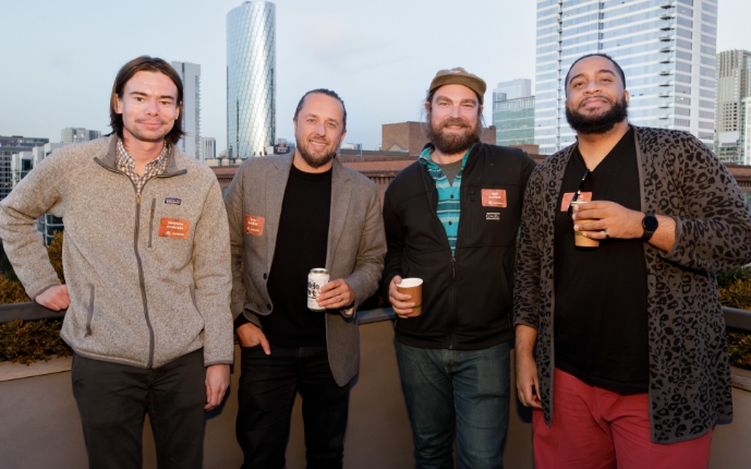 Group of Elevate employees standing outside and smiling