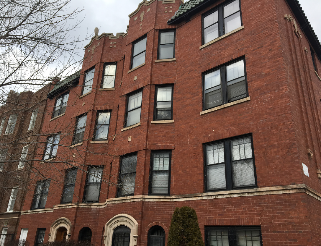 Image of red brick multifamily building