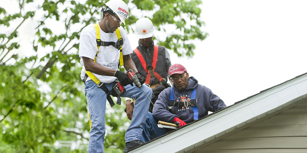 work men on a roof 