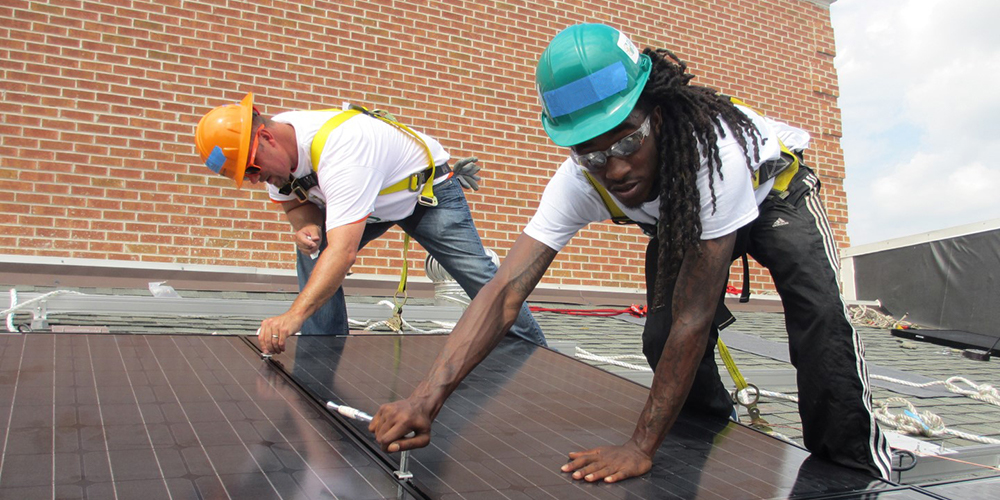 men working on a roof 