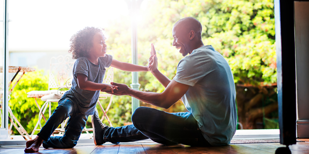 father and child enjoying playtime together 