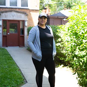 woman in front of house