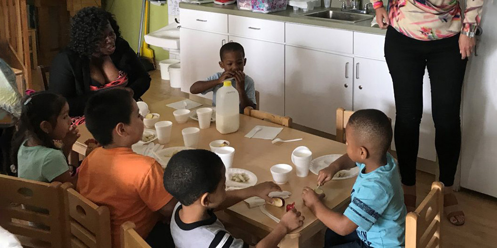 children around table at daycare 