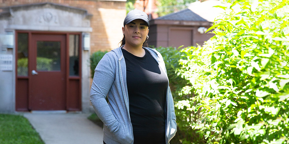 woman standing in front of a home